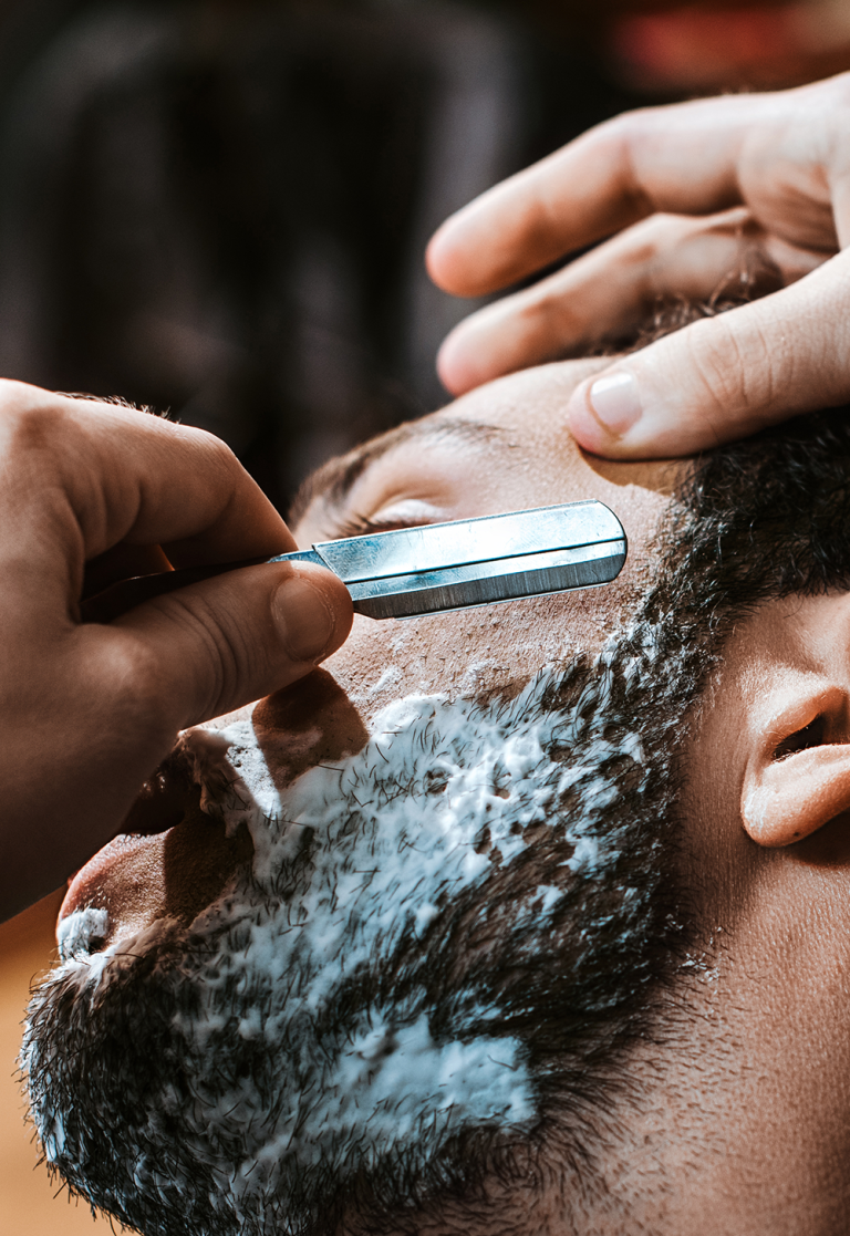 A man getting a Facial Shave Service.