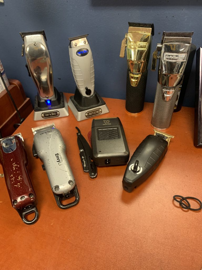 Image of different clippers laid out on a table.